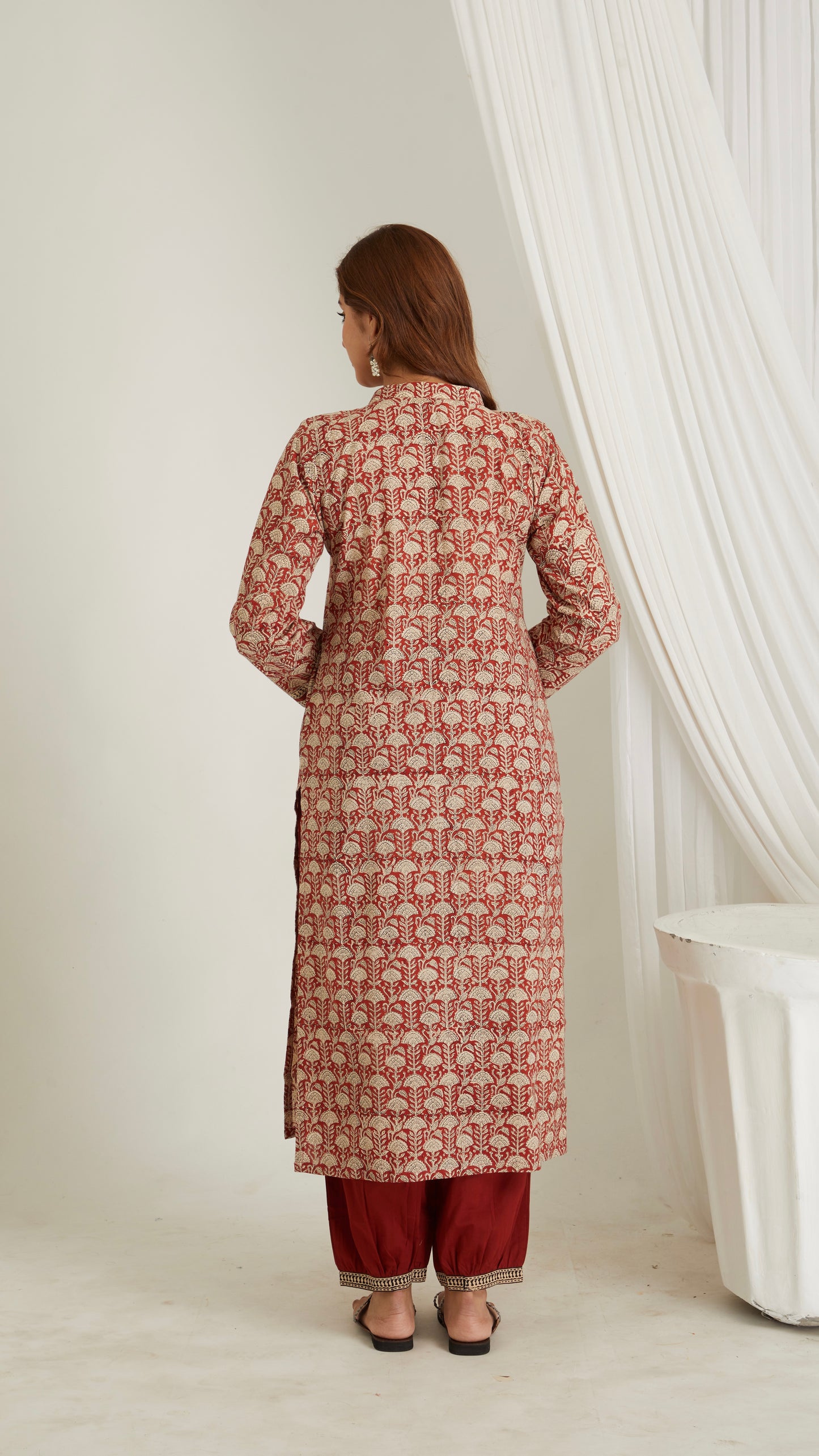 Woman wearing red hand block print cotton kurta with V-neck and 3/4 sleeves – back view