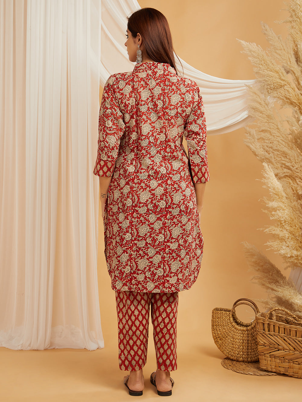 Back view of red hand block printed co-ord set showing back design and fall of cotton fabric