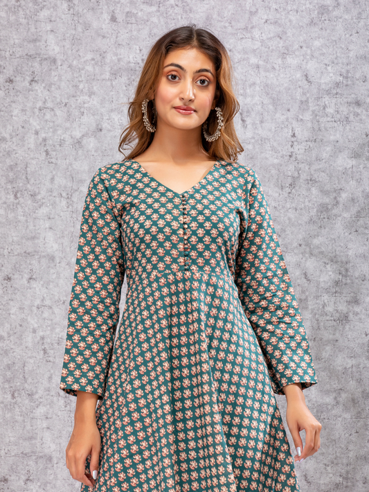 Close-up of traditional print on soft cotton fabric in green and beige tones|Meeta's