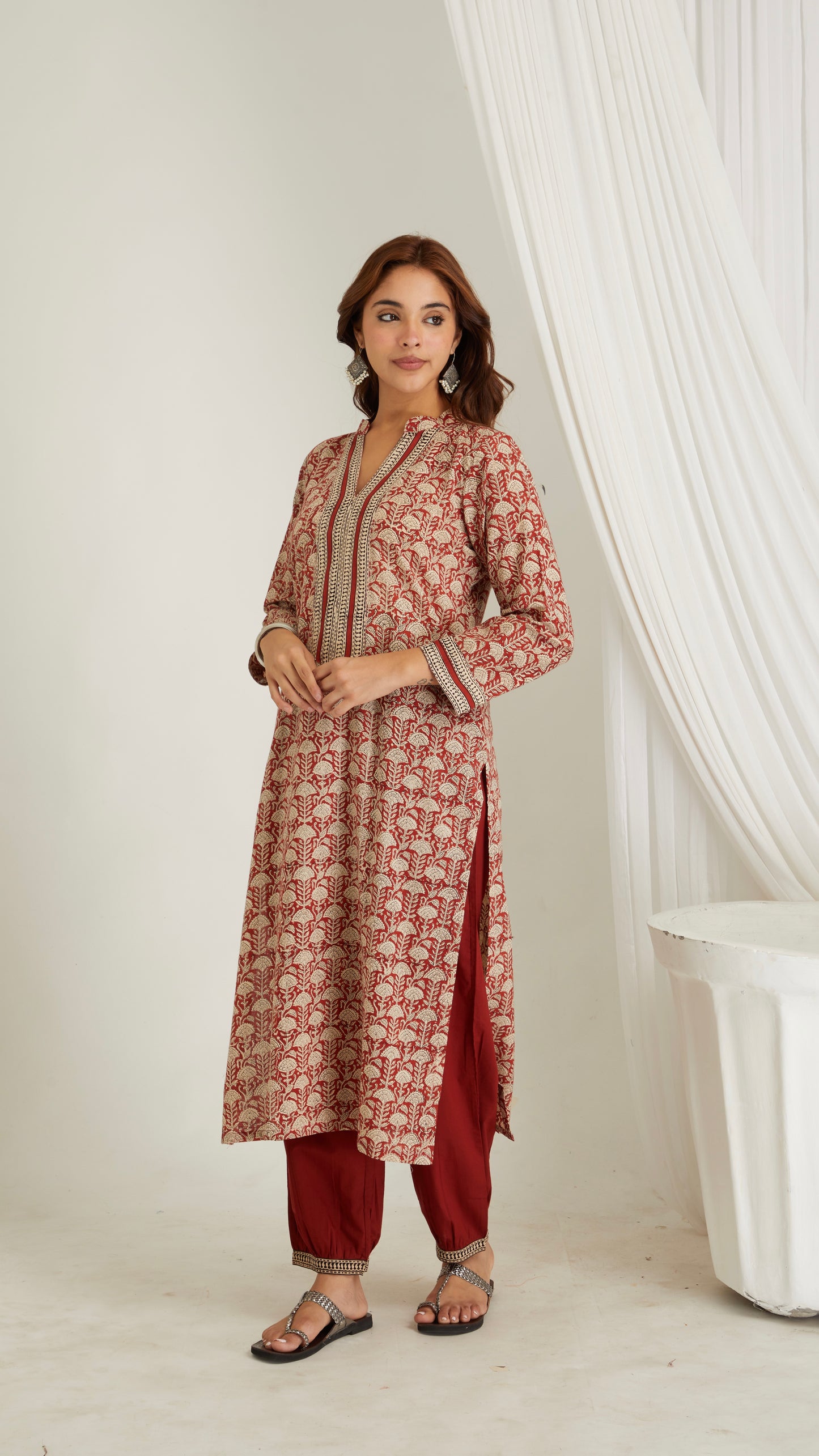 Woman wearing red hand block print cotton kurta with V-neck and 3/4 sleeves – front view
