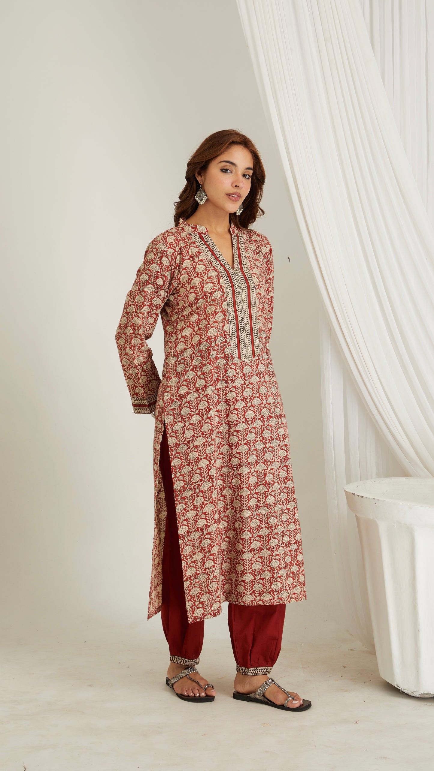Woman wearing red hand block print cotton kurta with V-neck and 3/4 sleeves – side view