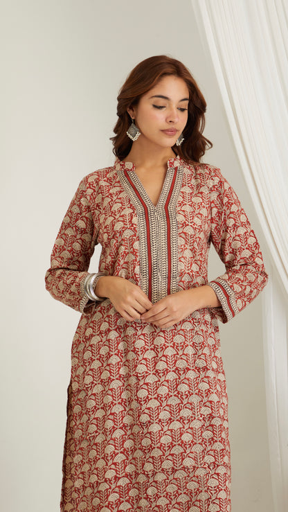 Close-up of red hand block print cotton kurta fabric showing print and texture- close up view
