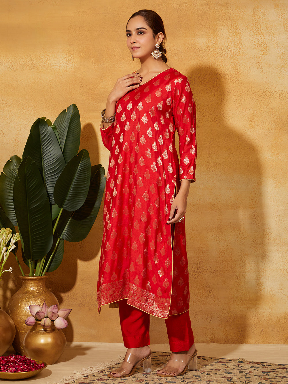 Side view of model wearing red Banarasi silk Kurta With Dupatta set with golden zari work â€“ elegant handcrafted ethnic wear by Meetaâ€™s