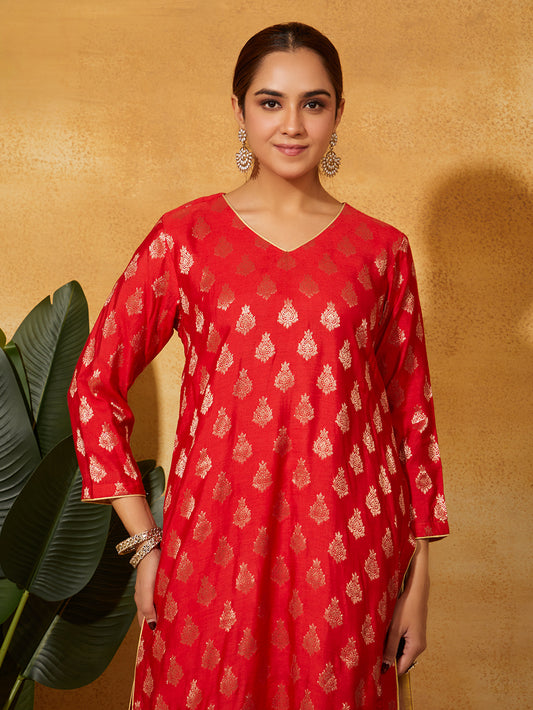 Close-up of golden zari motifs on red Banarasi silk suit – Meeta’s