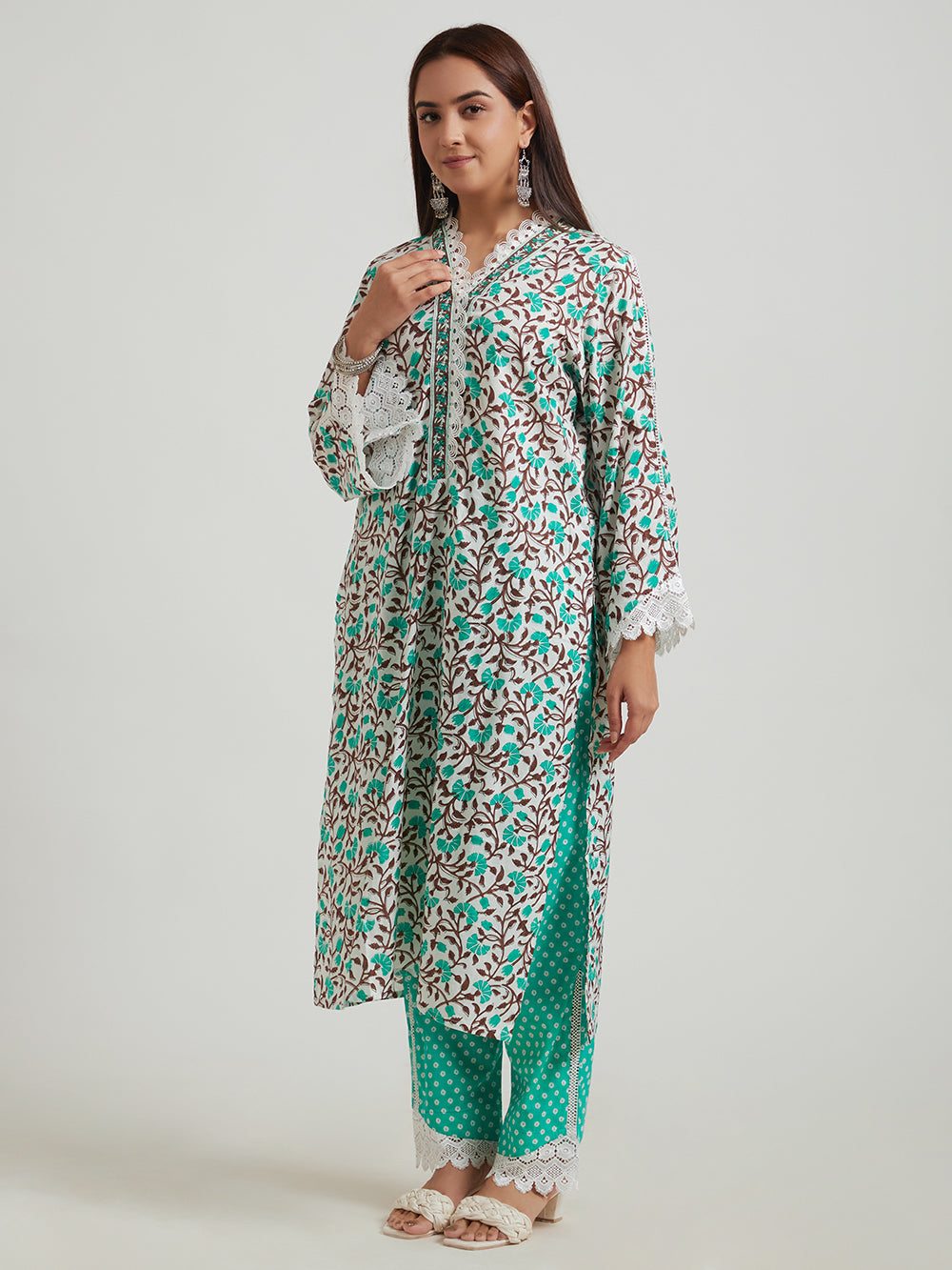 Women’s printed kurta set with green pants, side view