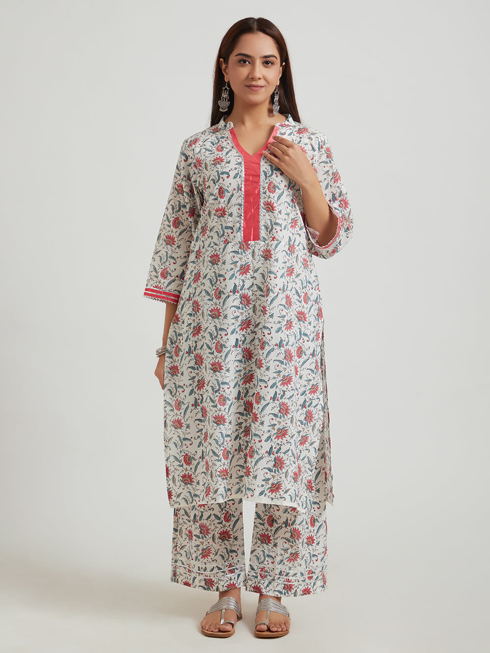 Multicolour hand block printed cotton suit set front view with kurta and pants .